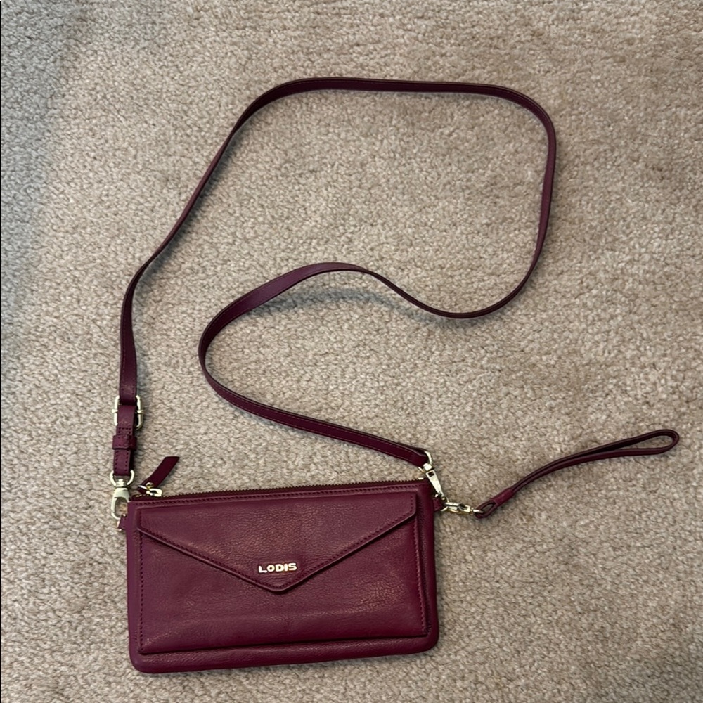 Lodis red Crossbody Bag with Adjustable Strap and Flap Closure
